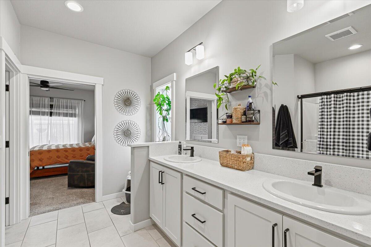 248 Christopher Way Talent, OR 97540 - Photo 15 of 33 a en suite bathroom with double sink and a mirror