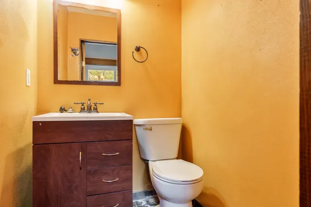 a bathroom with a toilet and a sink