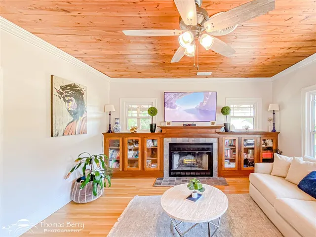 a bedroom with a bed and flat screen tv