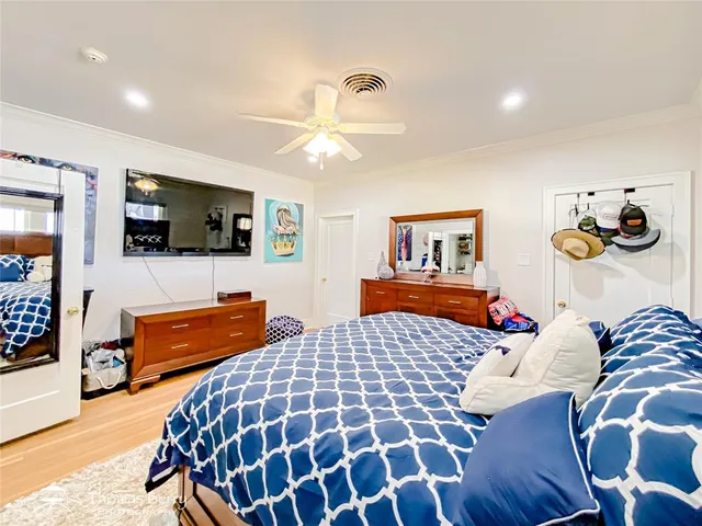 a bathroom with a sink mirror vanity and toilet