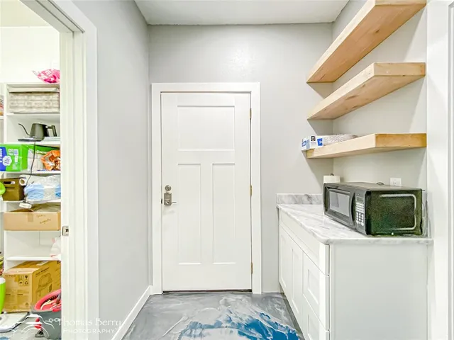 a bathroom with a sink a mirror and a toilet