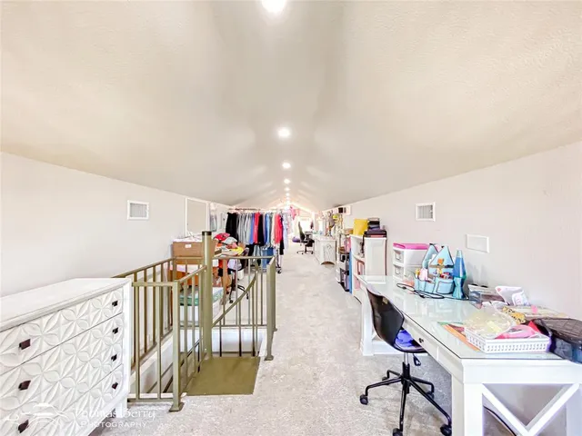 a living room with lots of furniture and gym equipment