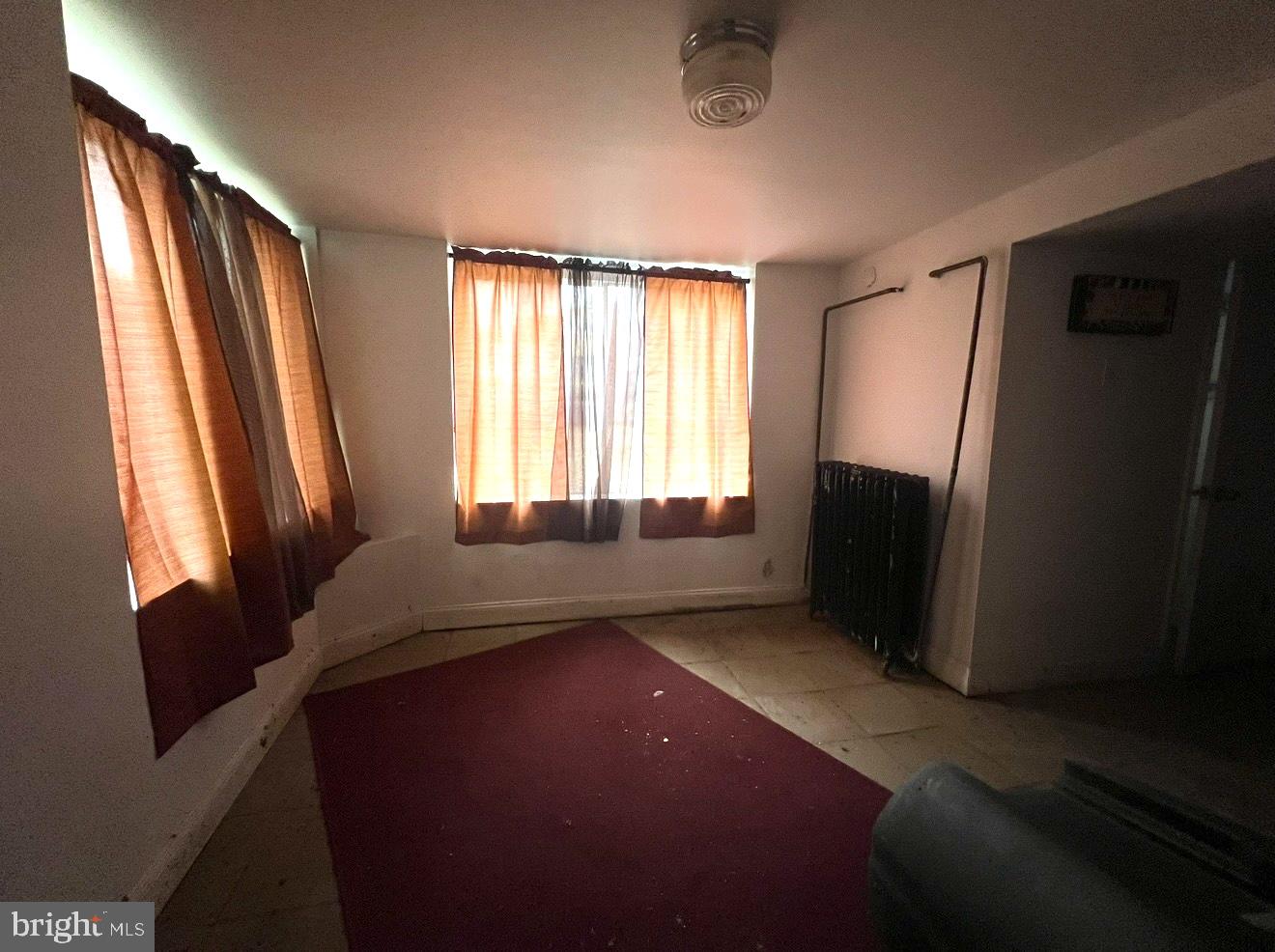 2432 4th Street Northeast Washington, DC 20002 - Photo 12 of 15 a living room with a bed furniture and a window