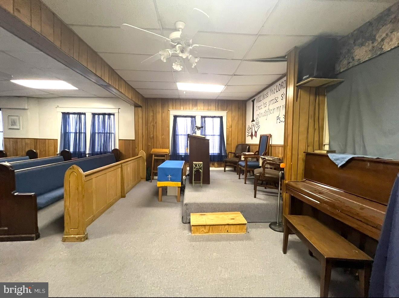 2432 4th Street Northeast Washington, DC 20002 - Photo 6 of 15 a living room with furniture a fireplace and a chandelier