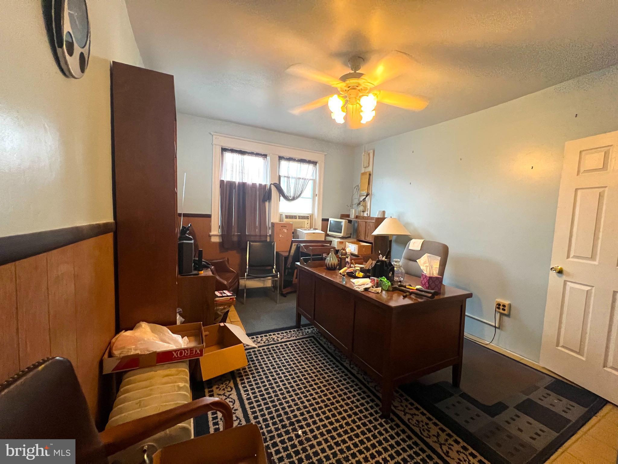 2432 4th Street Northeast Washington, DC 20002 - Photo 9 of 15 a living room with furniture and a chandelier