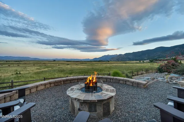 a view of a lake with couches in front of house