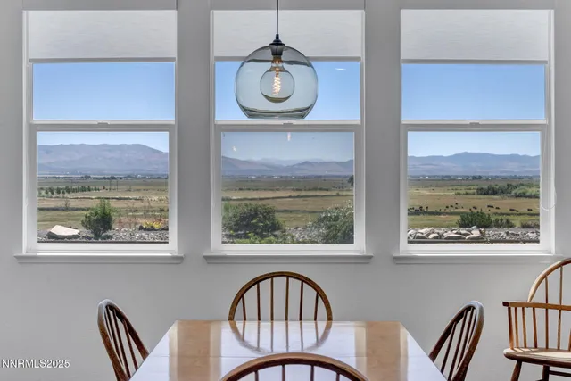 a view of a hallway with front door and windows