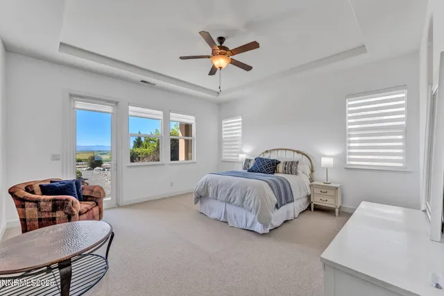 a bedroom with bed and window