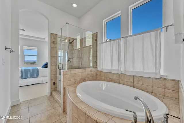 a bathroom with a bathtub and shower