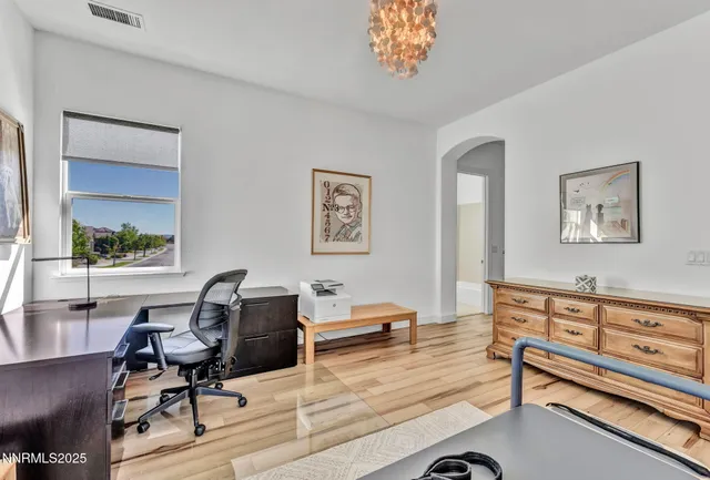 a bedroom with furniture and a window