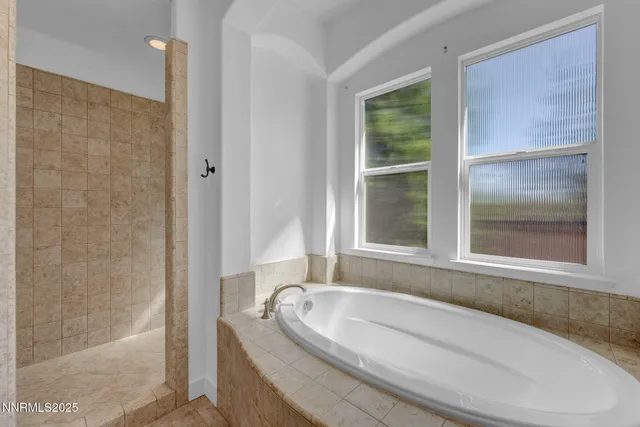 a bath tub sitting next to a window