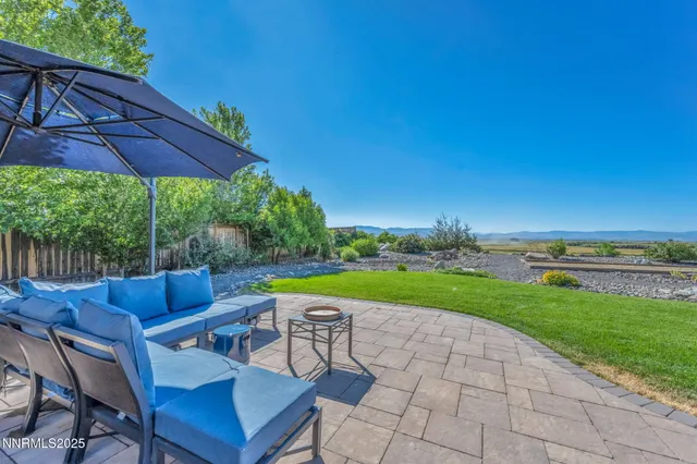 a view of yard with seating area and barbeque oven