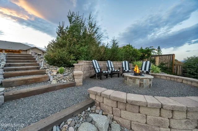 a view of backyard with seating space