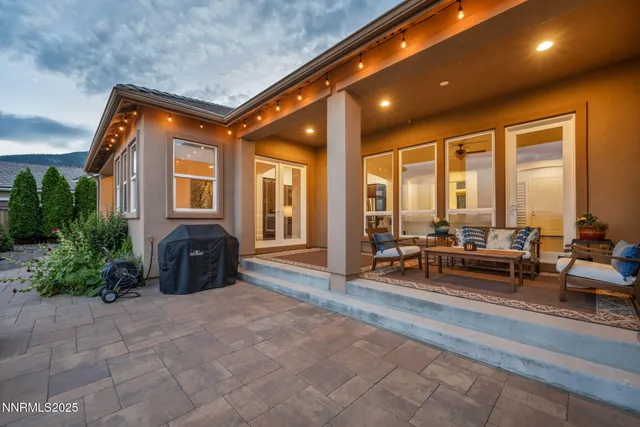 a lobby with furniture and floor to ceiling window