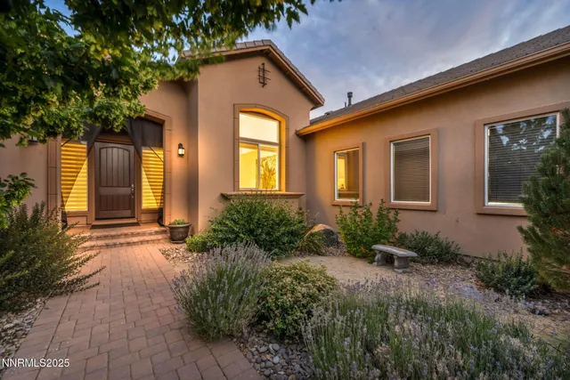 a front view of house and yard with green space