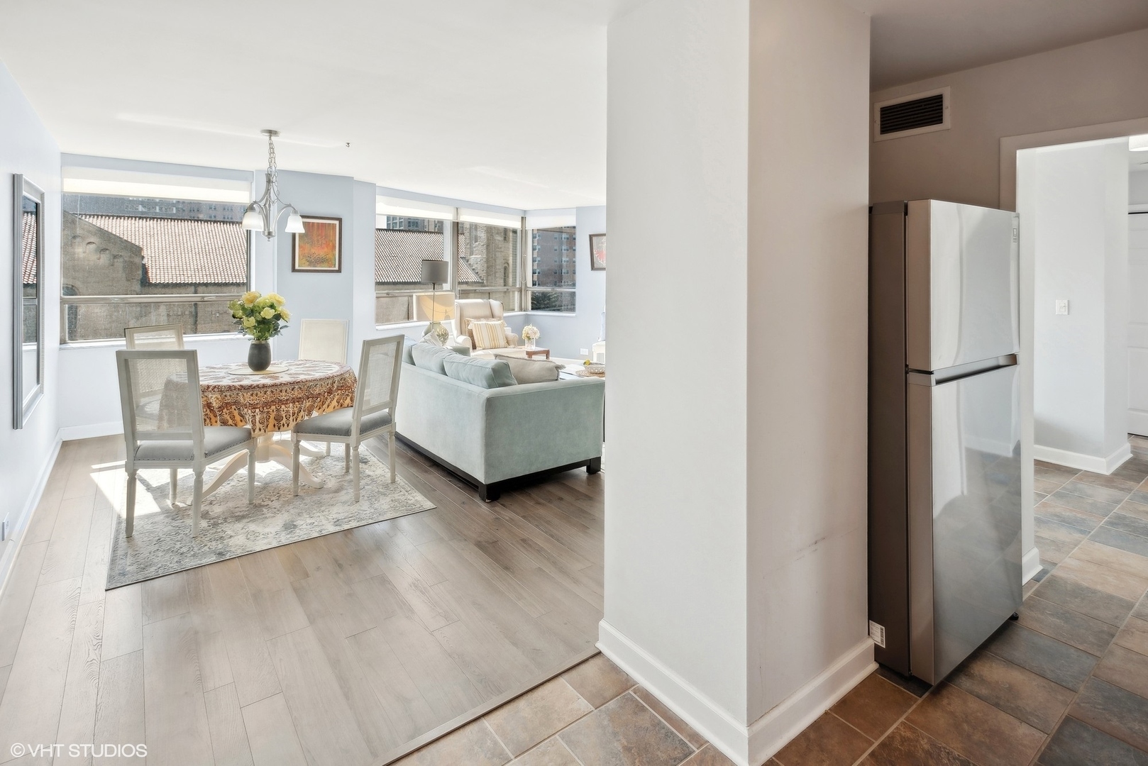 5701 North Sheridan Road, Unit 4Q Chicago, IL 60660 - Photo 12 of 23 a living room with furniture and a refrigerator