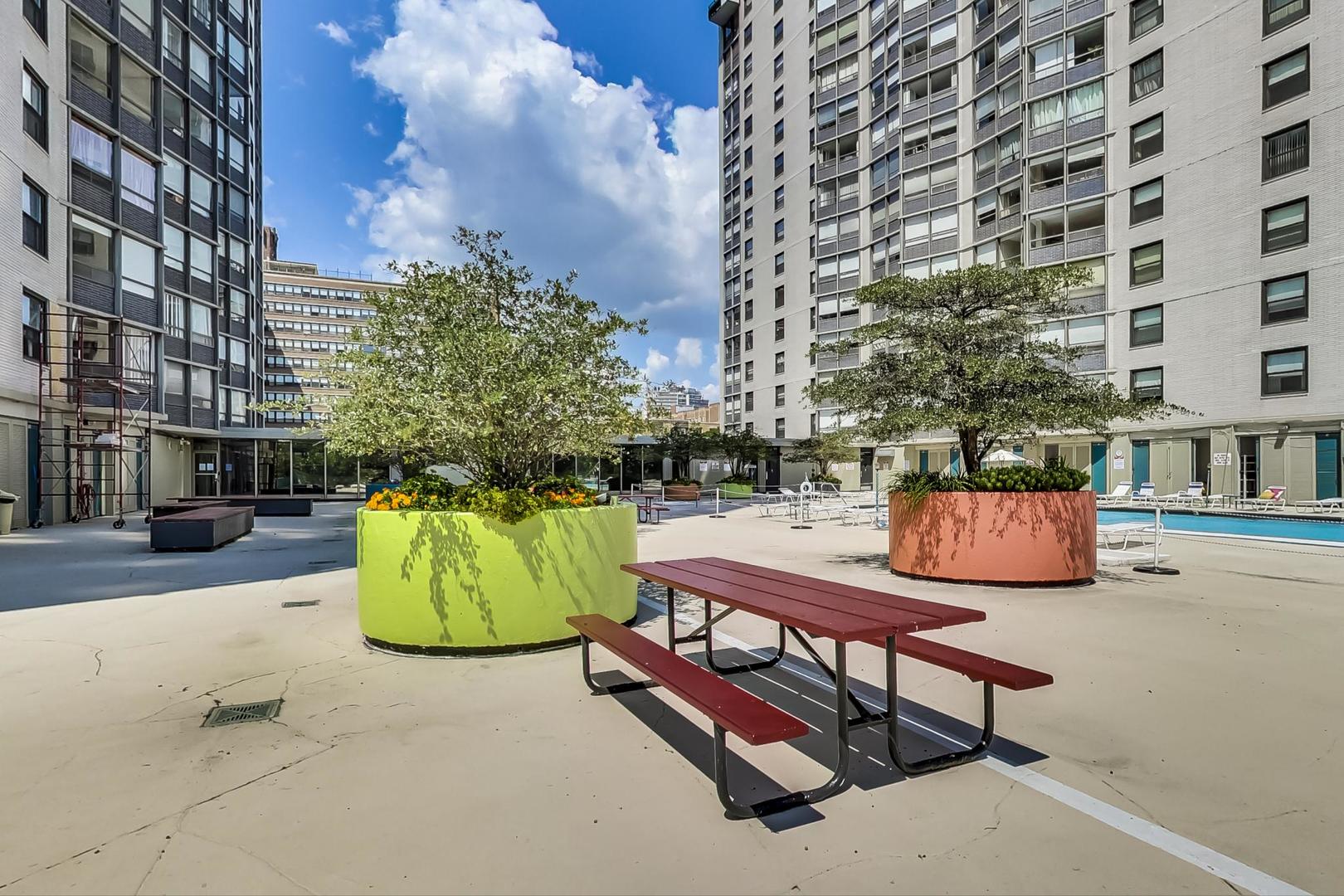 5701 North Sheridan Road, Unit 4Q Chicago, IL 60660 - Photo 20 of 23 a view of a bench in the street