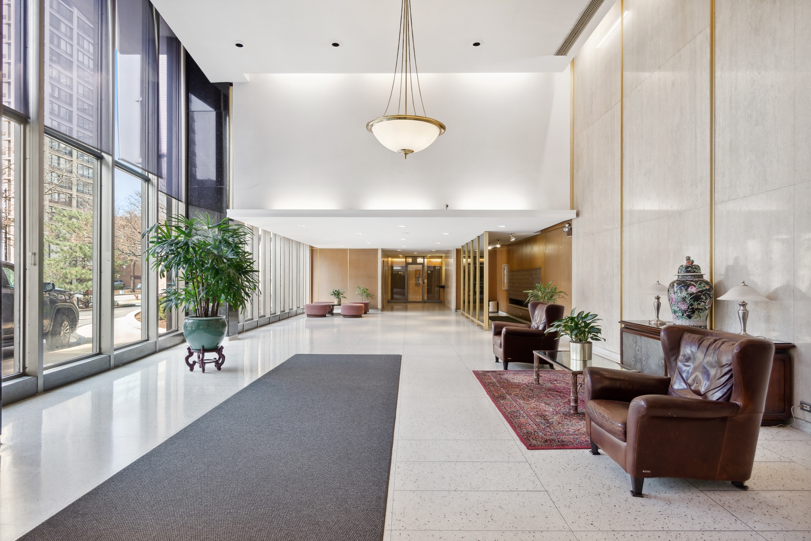 5701 North Sheridan Road, Unit 4Q Chicago, IL 60660 - Photo 2 of 23 a living room with furniture and a large window