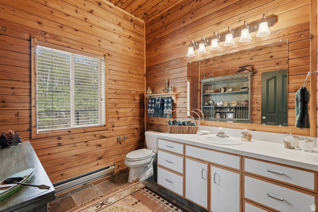 6 Beaver Springs Rancheros Oakley, UT 84055 - Photo 10 of 68 Bathroom featuring wood-paneled walls, a single window with blinds, and tile flooring