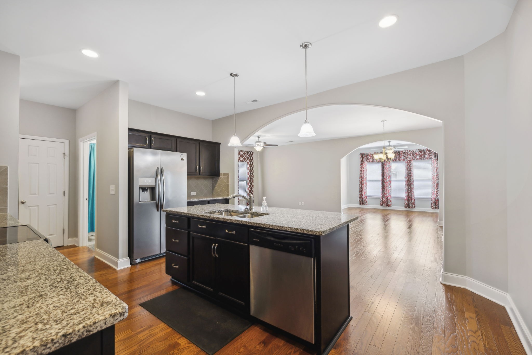 1229 Mayflower Way Lebanon, TN 37087 - Photo 13 of 42 a kitchen with stainless steel appliances granite countertop a sink a stove and a wooden floors