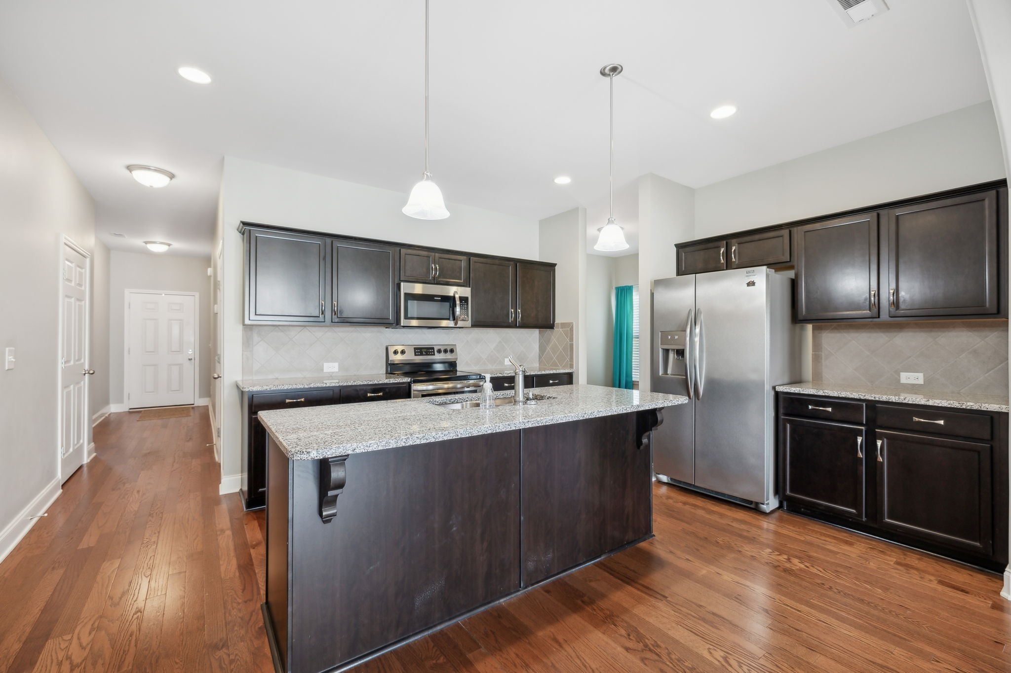 1229 Mayflower Way Lebanon, TN 37087 - Photo 14 of 42 a kitchen with stainless steel appliances a sink stove and refrigerator