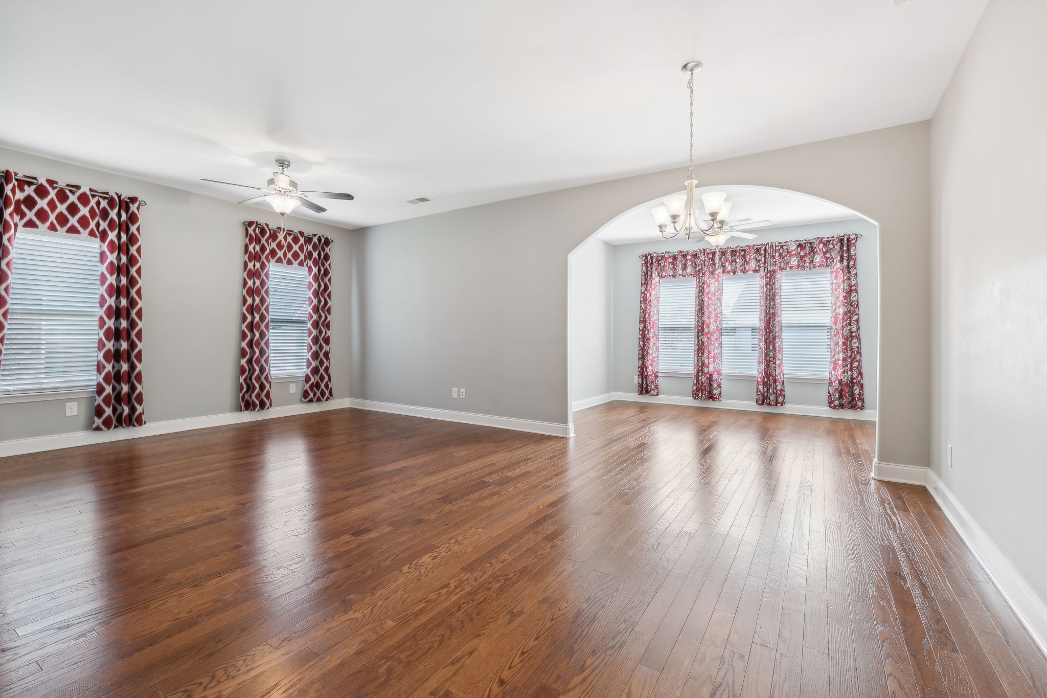 1229 Mayflower Way Lebanon, TN 37087 - Photo 16 of 42 a view of an empty room with wooden floor and fan