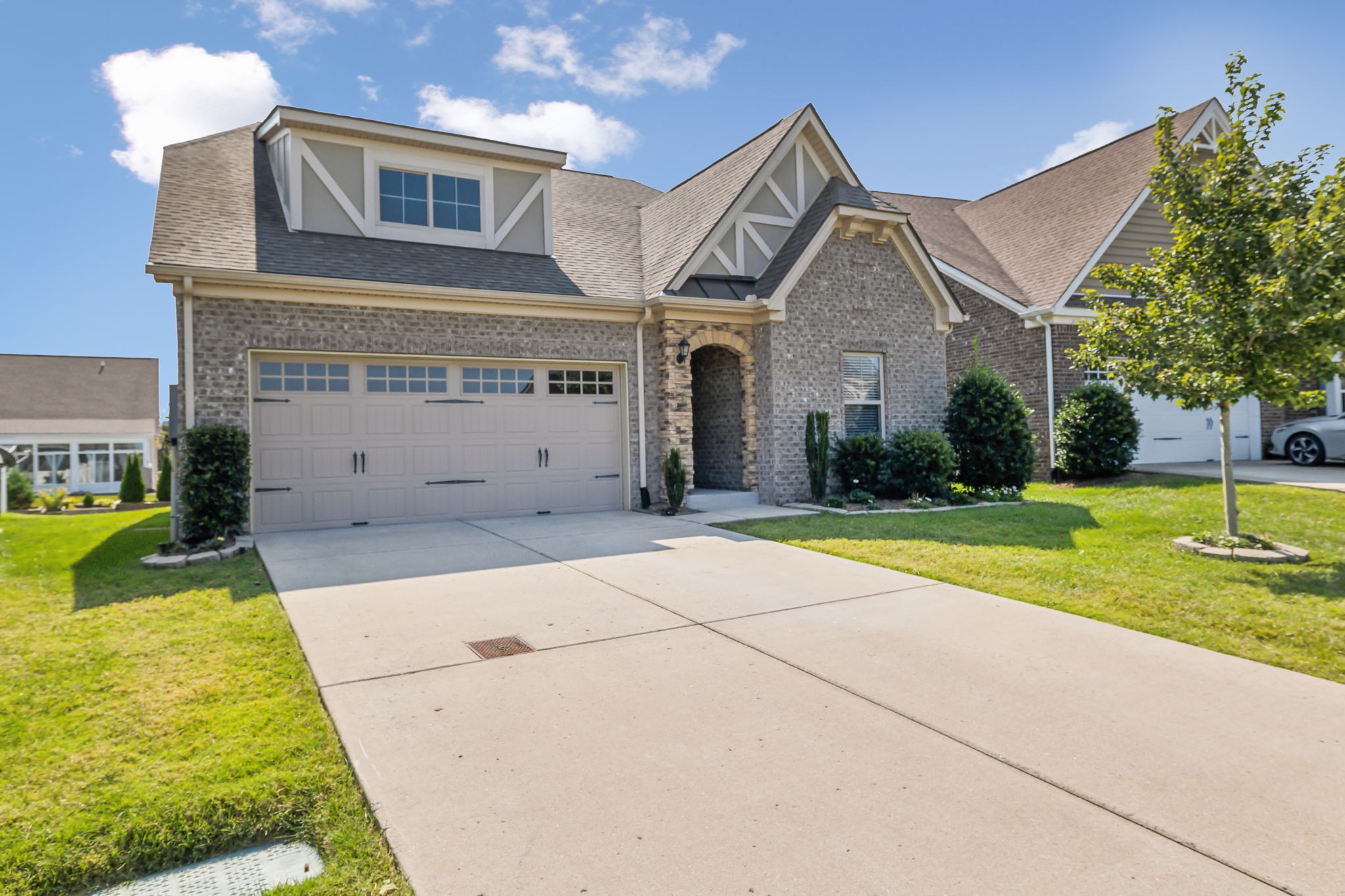 1229 Mayflower Way Lebanon, TN 37087 - Photo 2 of 42 a view of a white house with a big yard and potted plants