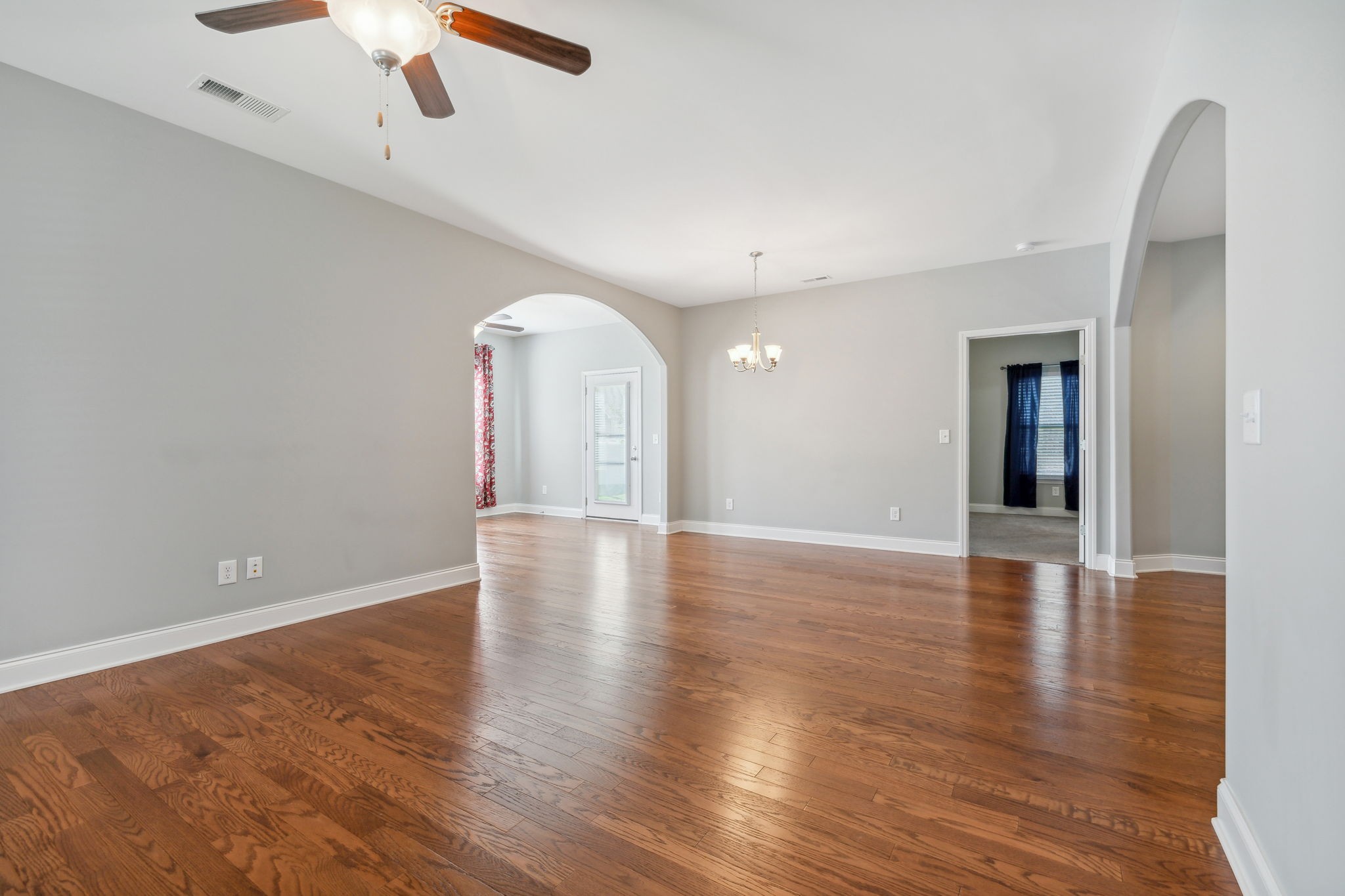 1229 Mayflower Way Lebanon, TN 37087 - Photo 21 of 42 a view of an empty room with window and wooden floor