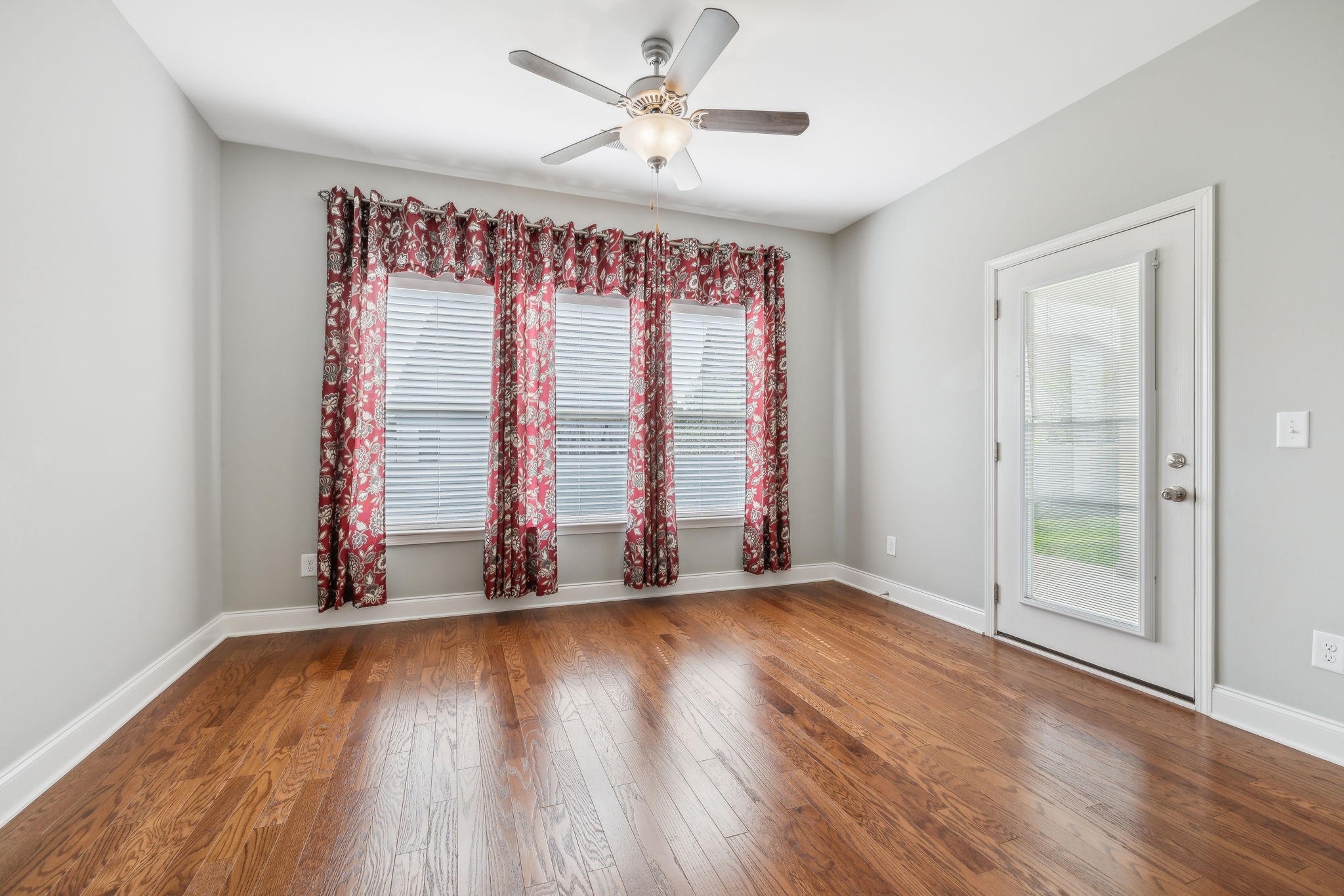 1229 Mayflower Way Lebanon, TN 37087 - Photo 22 of 42 wooden floor in an empty room with a window