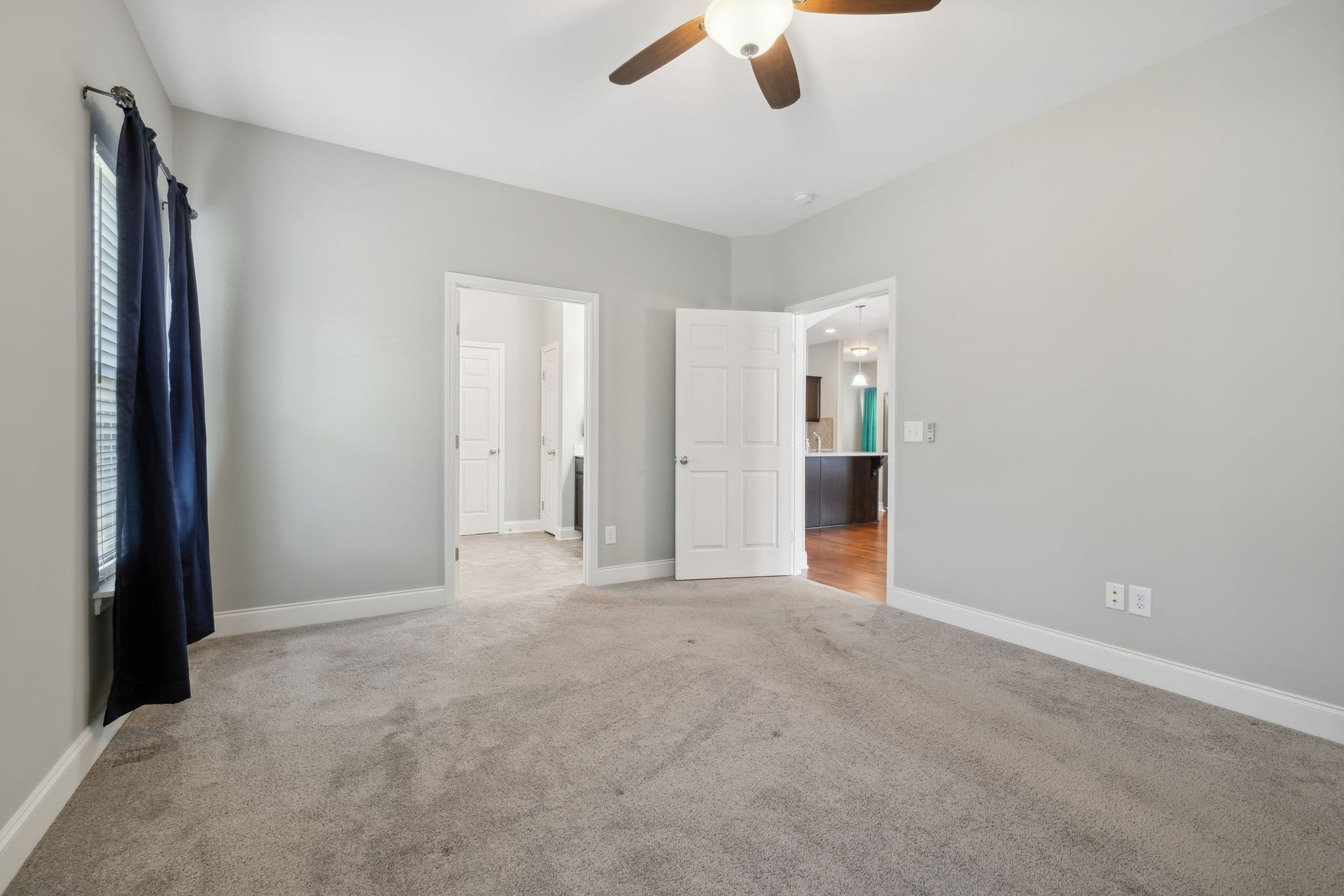 1229 Mayflower Way Lebanon, TN 37087 - Photo 26 of 42 an empty room with chandelier fan and windows