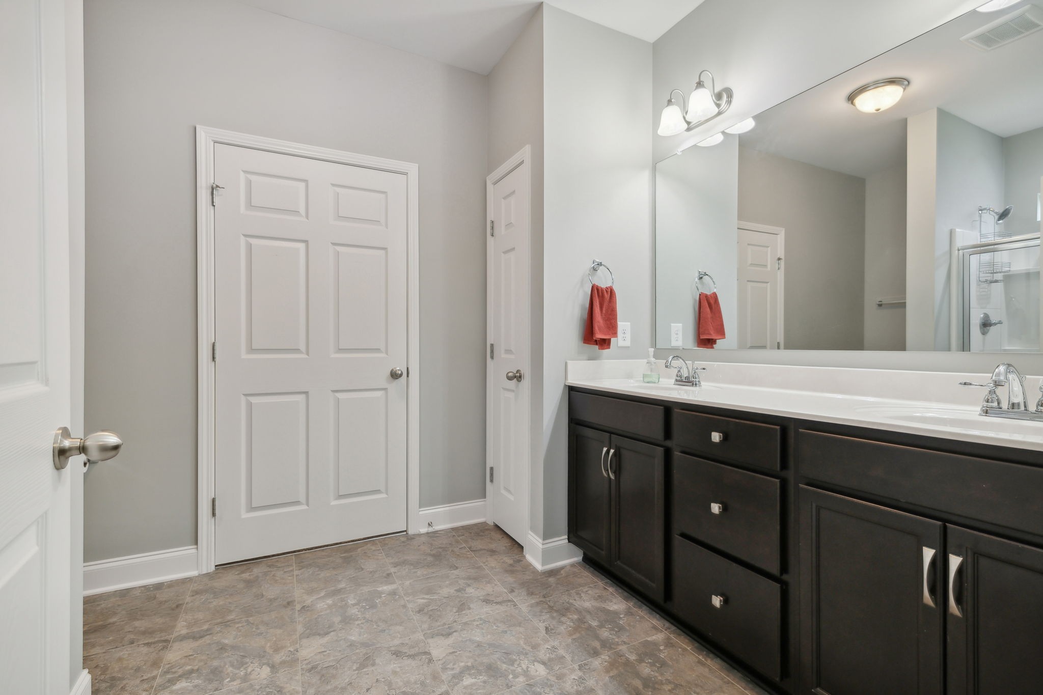 1229 Mayflower Way Lebanon, TN 37087 - Photo 27 of 42 a bathroom with a double vanity sink and mirror