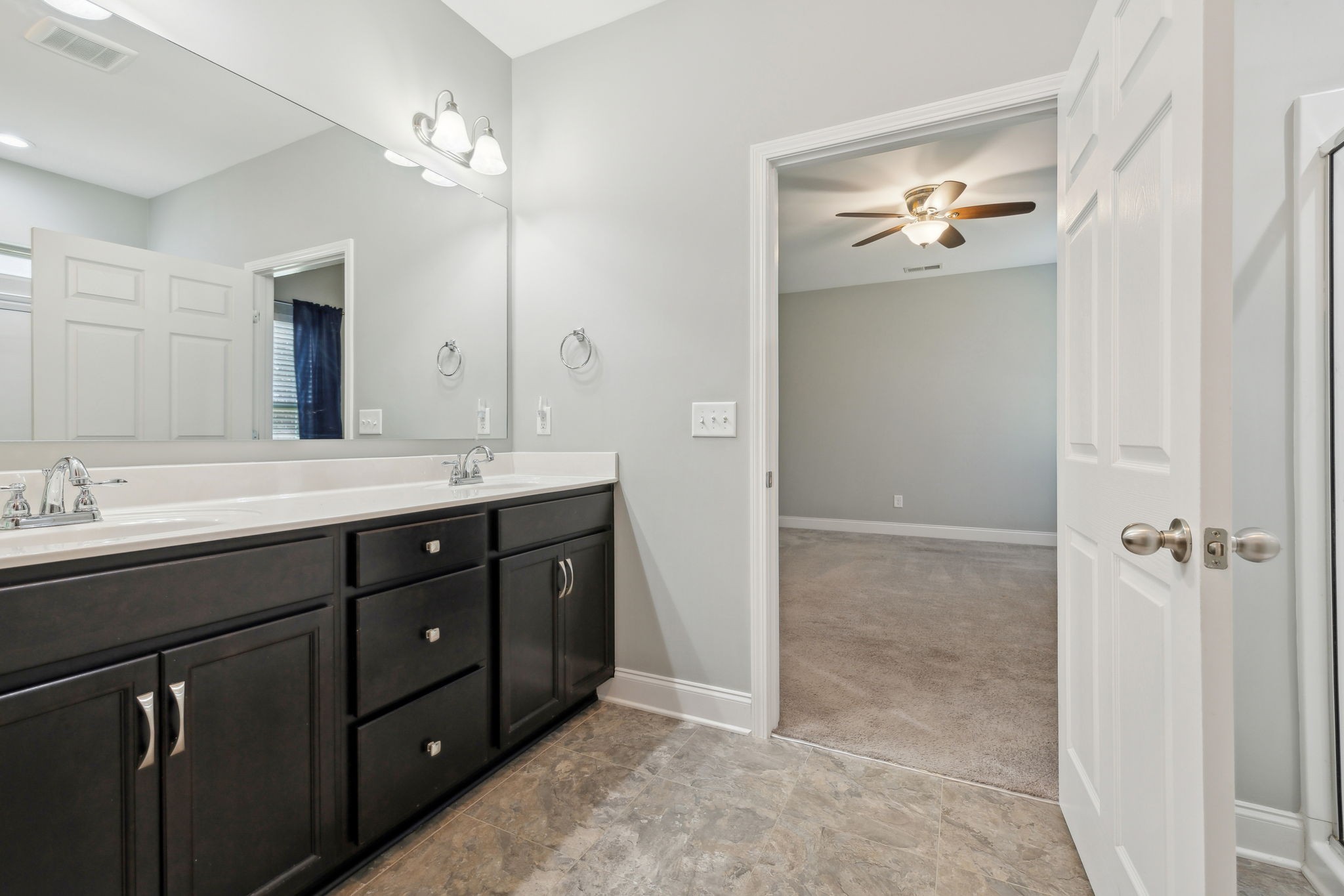 1229 Mayflower Way Lebanon, TN 37087 - Photo 28 of 42 a bathroom with a double vanity sink and mirror