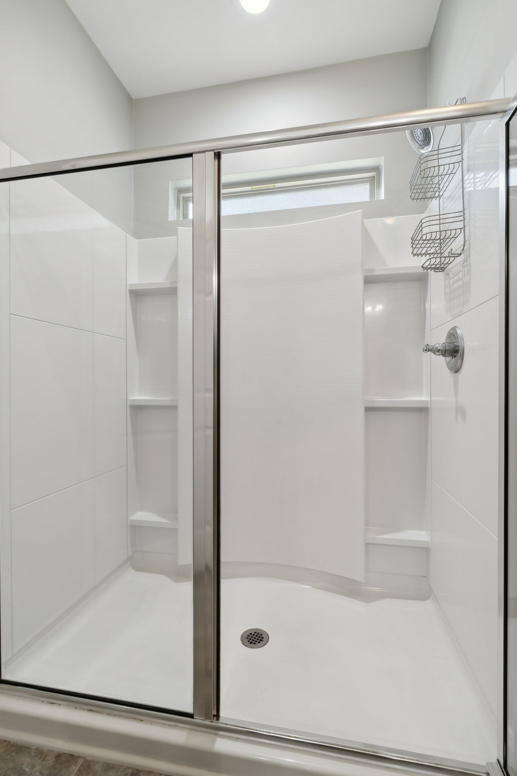 1229 Mayflower Way Lebanon, TN 37087 - Photo 29 of 42 a bathroom with a glass shower door