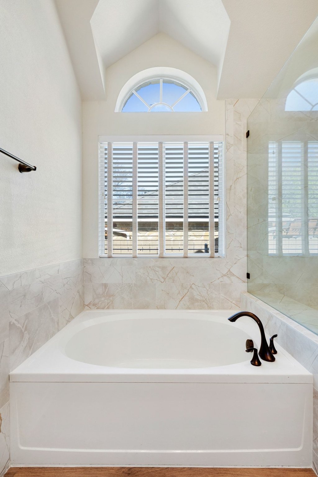 322 River Bluff Circle Georgetown, TX 78626 - Photo 18 of 35 a bathroom with bathtub next to a window