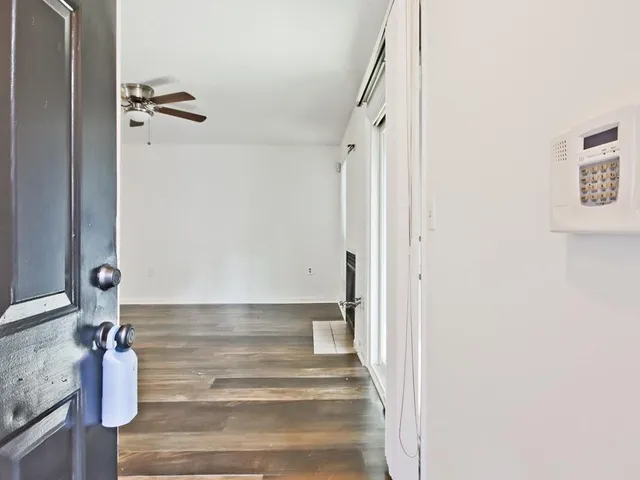 a view of staircase with white walls