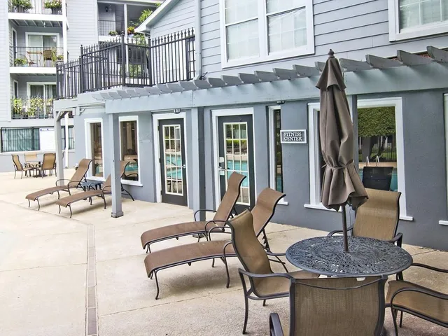 a view of a dinning tables and chairs in patio