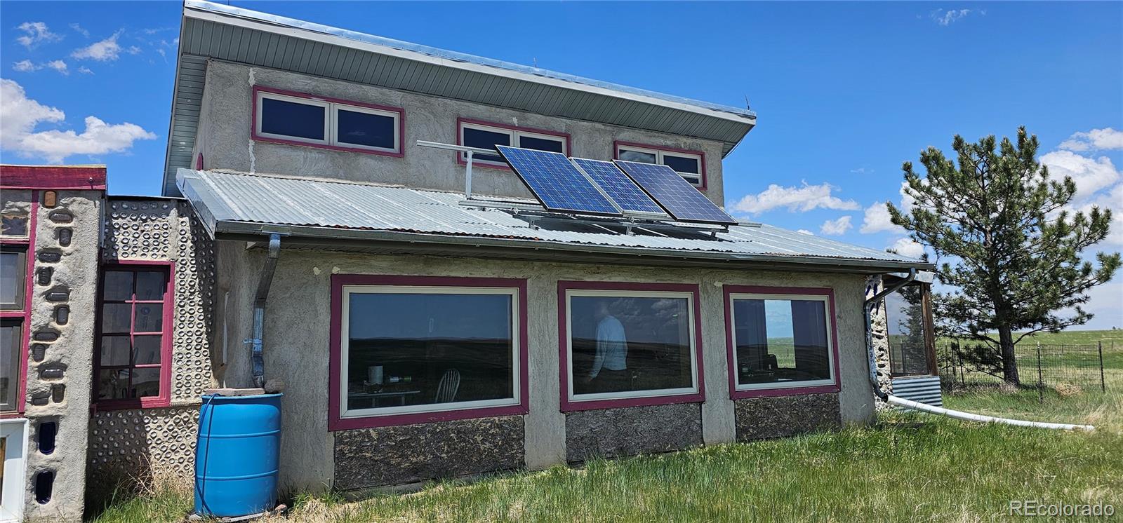 Wa County Road Cope, CO 80812 - Photo 1 of 48 a house that has a tree in front of the house