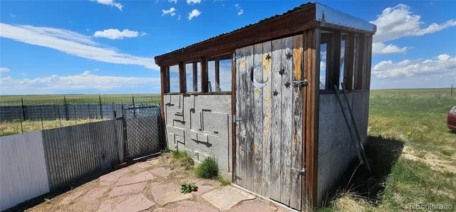 a view of a back yard from a balcony