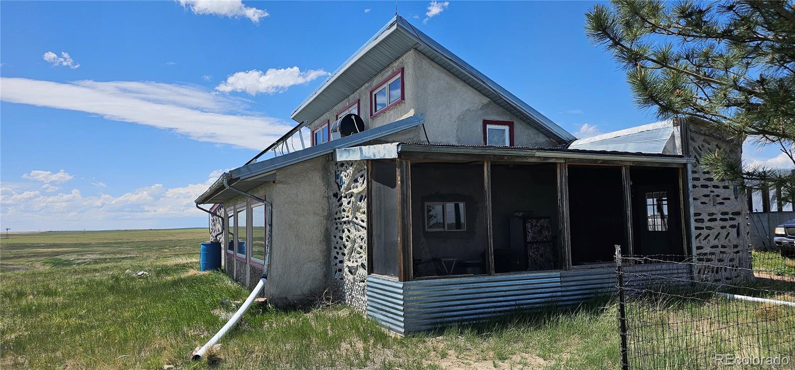 Wa County Road Cope, CO 80812 - Photo 19 of 48 a front view of a house with a yard