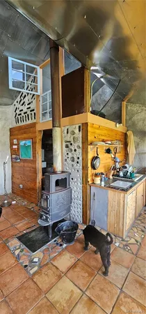 a view of living room with furniture and a fireplace