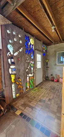 a bedroom with a bed and a mirror