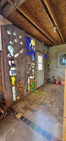 a bedroom with a bed and a mirror