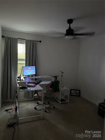 a view of a workspace with furniture