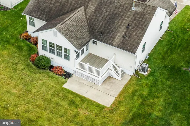 an aerial view of house with yard