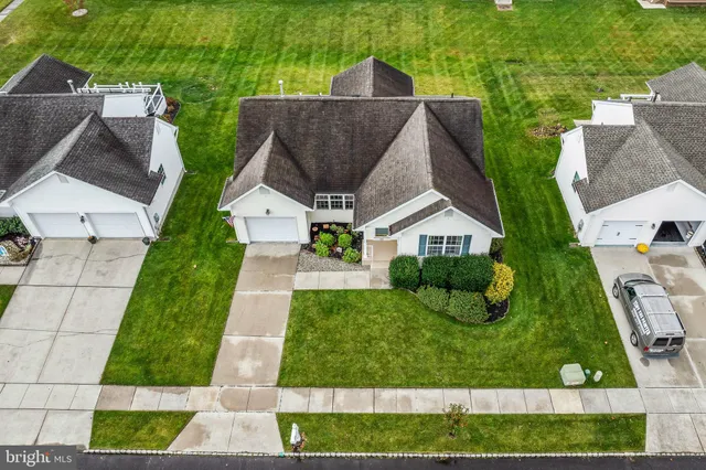 a aerial view of a house with swimming pool garden and patio