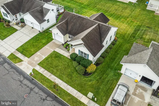 an aerial view of a house with a garden