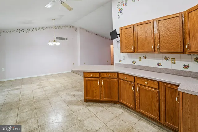 a bathroom with a sink vanity and mirror