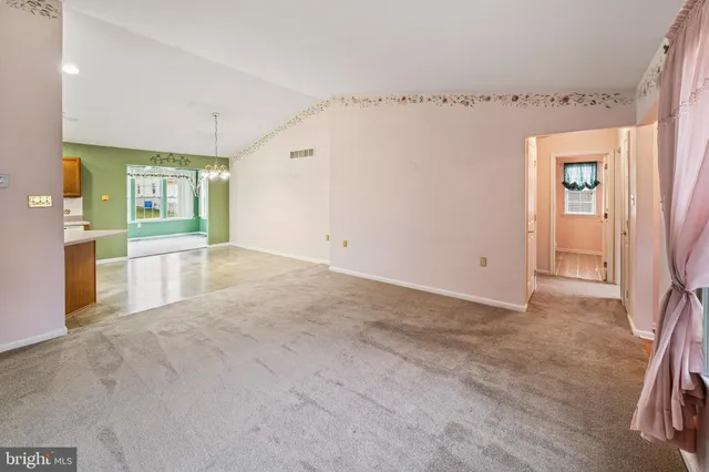 a view of a big room with windows and cabinet