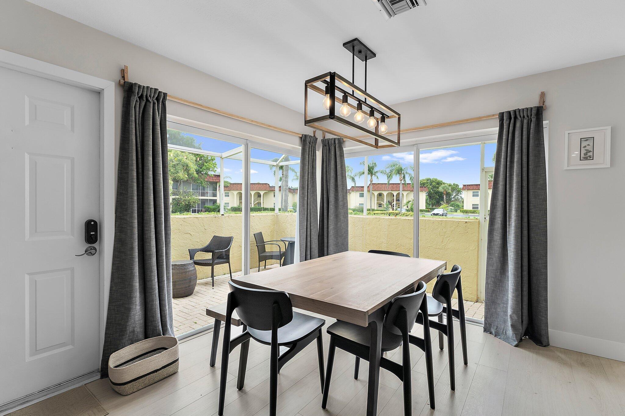 717 Highway 1, Unit 804 Jupiter, FL 33477 - Photo 15 of 45 Dining area with sliding glass doors