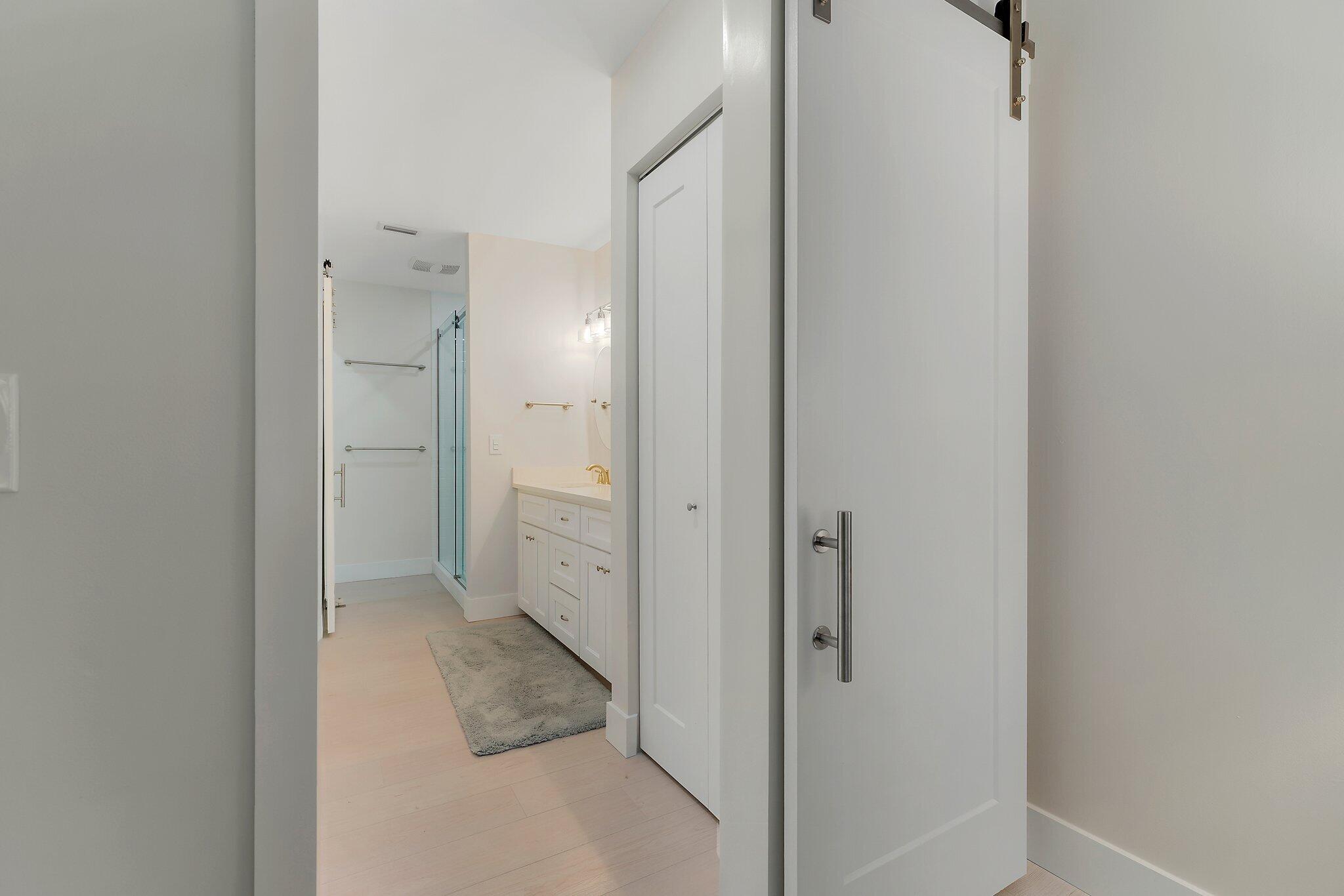717 Highway 1, Unit 804 Jupiter, FL 33477 - Photo 24 of 45 Barn doors leading to bath